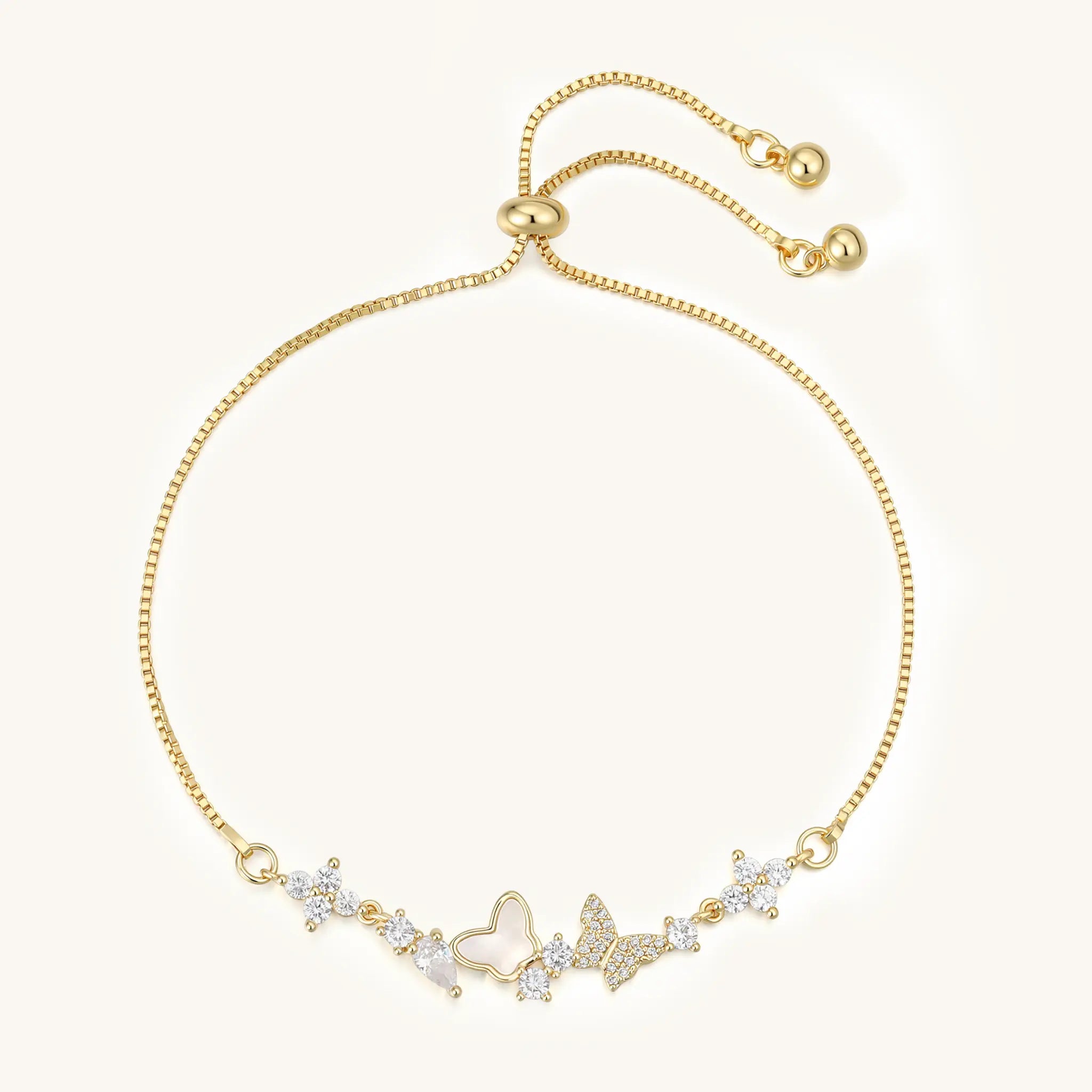 Top view of Vilrian adjustable gold bolo bracelet with mother of pearl butterfly charm