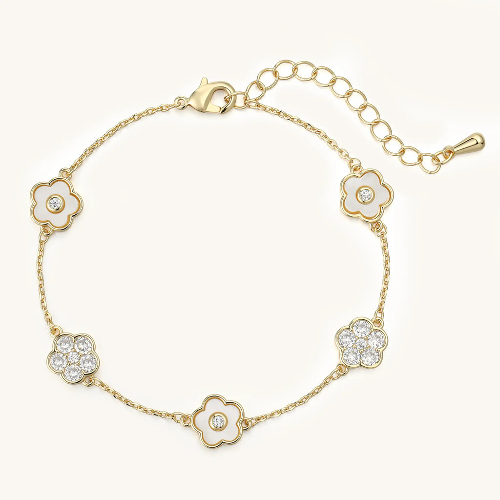 Top view of Vilrian adjustable gold floral bracelet with lobster clasp and extension chain