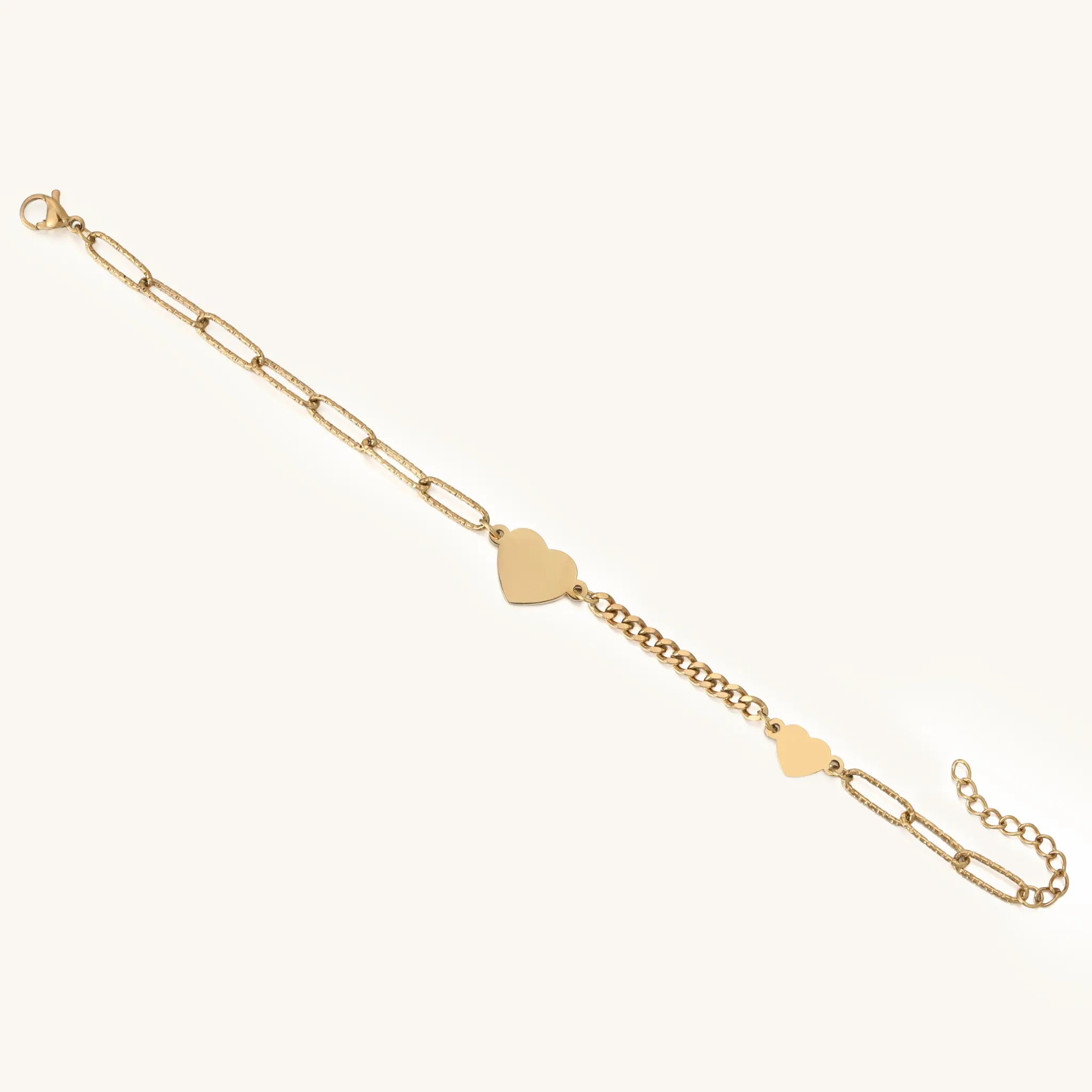 Full length view showing mixed paperclip and curb chains of Vilrian gold heart bracelet