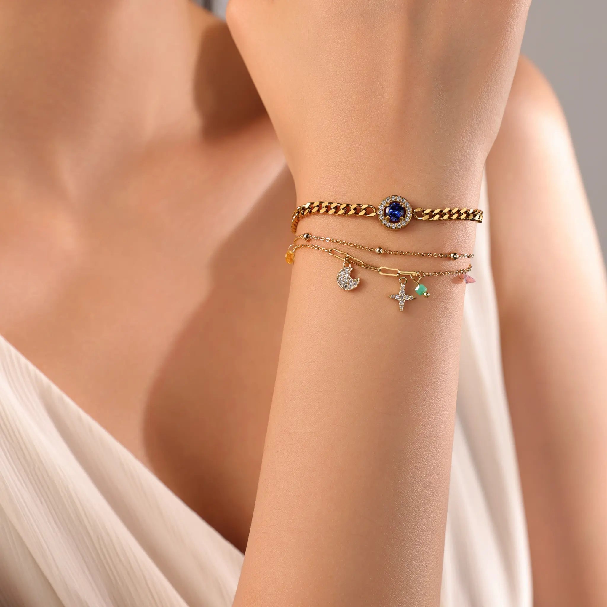 Gold bracelet stacking inspiration featuring Vilrian celestial charm bracelet and curb chain