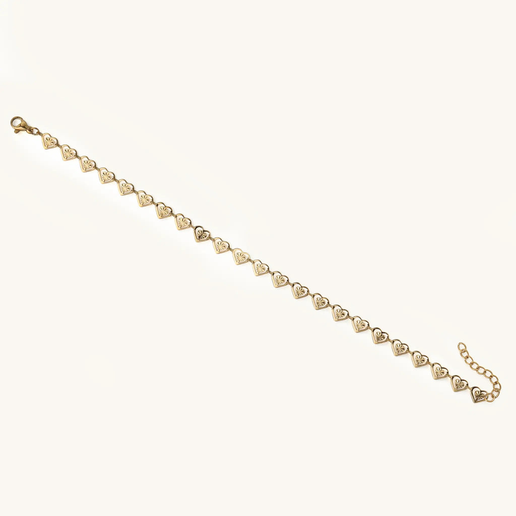 Full length view of Vilrian gold stainless steel hollow heart link chain bracelet