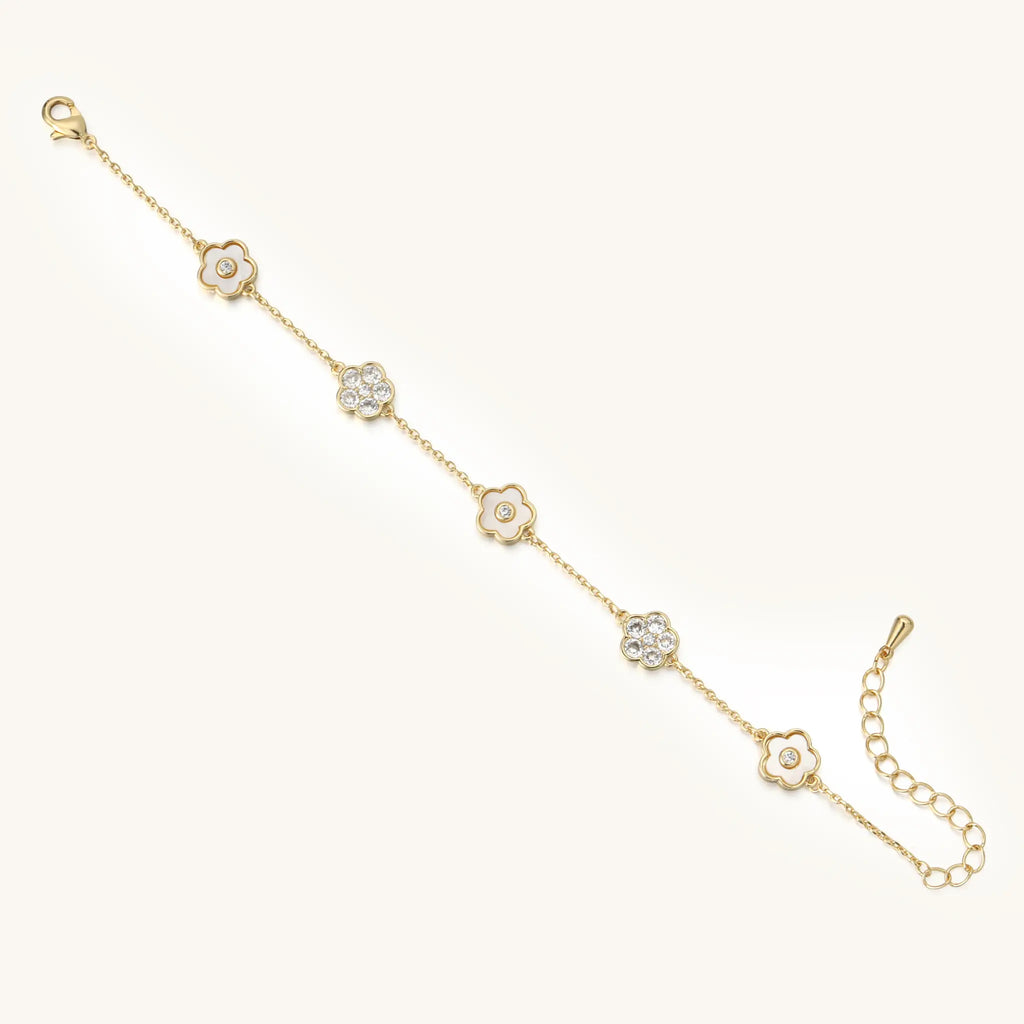 Full length flat lay view of Vilrian gold flower charm bracelet
