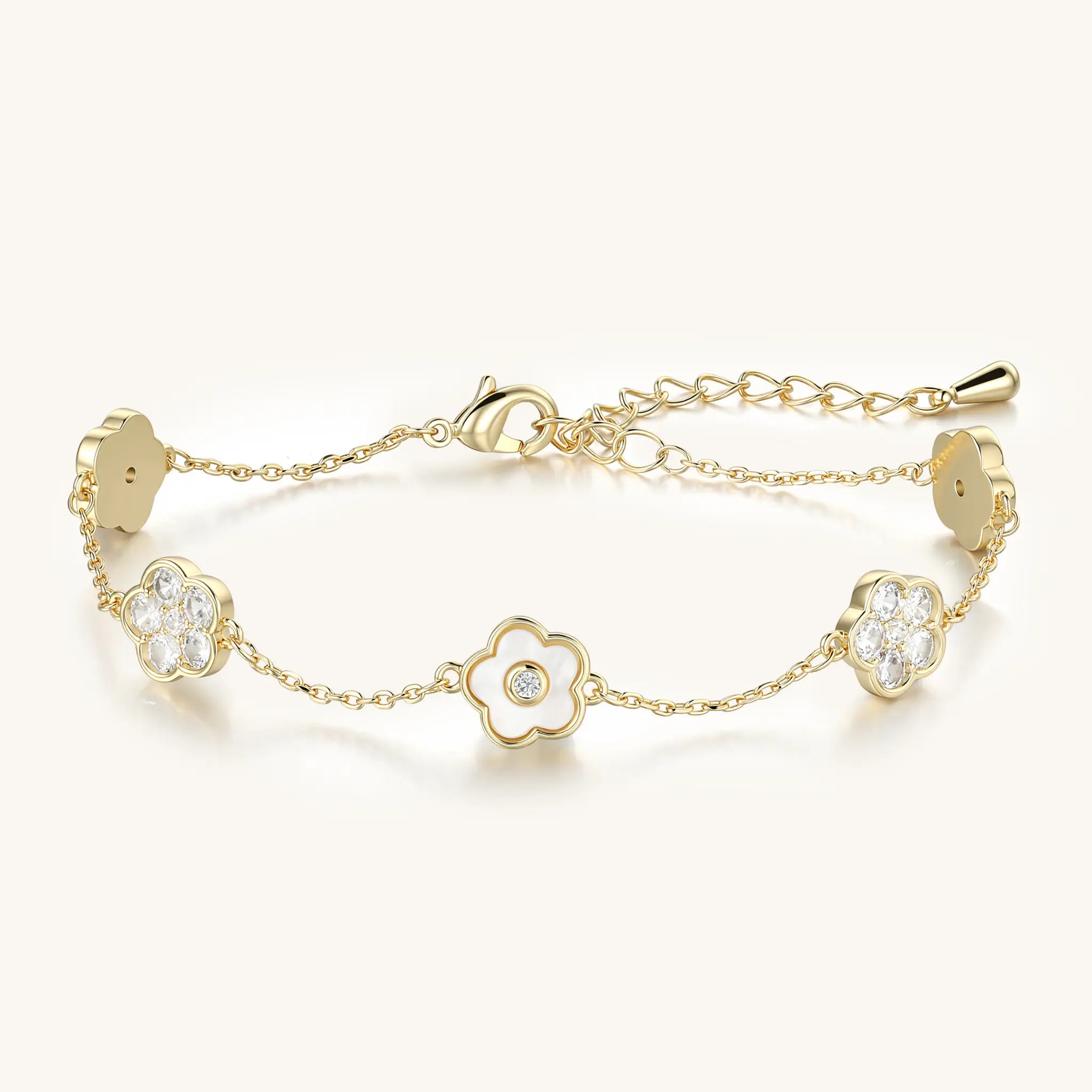 Vilrian gold floral charm bracelet with mother of pearl and cubic zirconia flowers