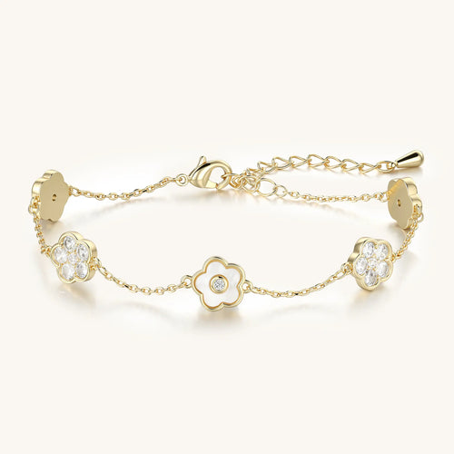 Vilrian gold floral charm bracelet with mother of pearl and cubic zirconia flowers
