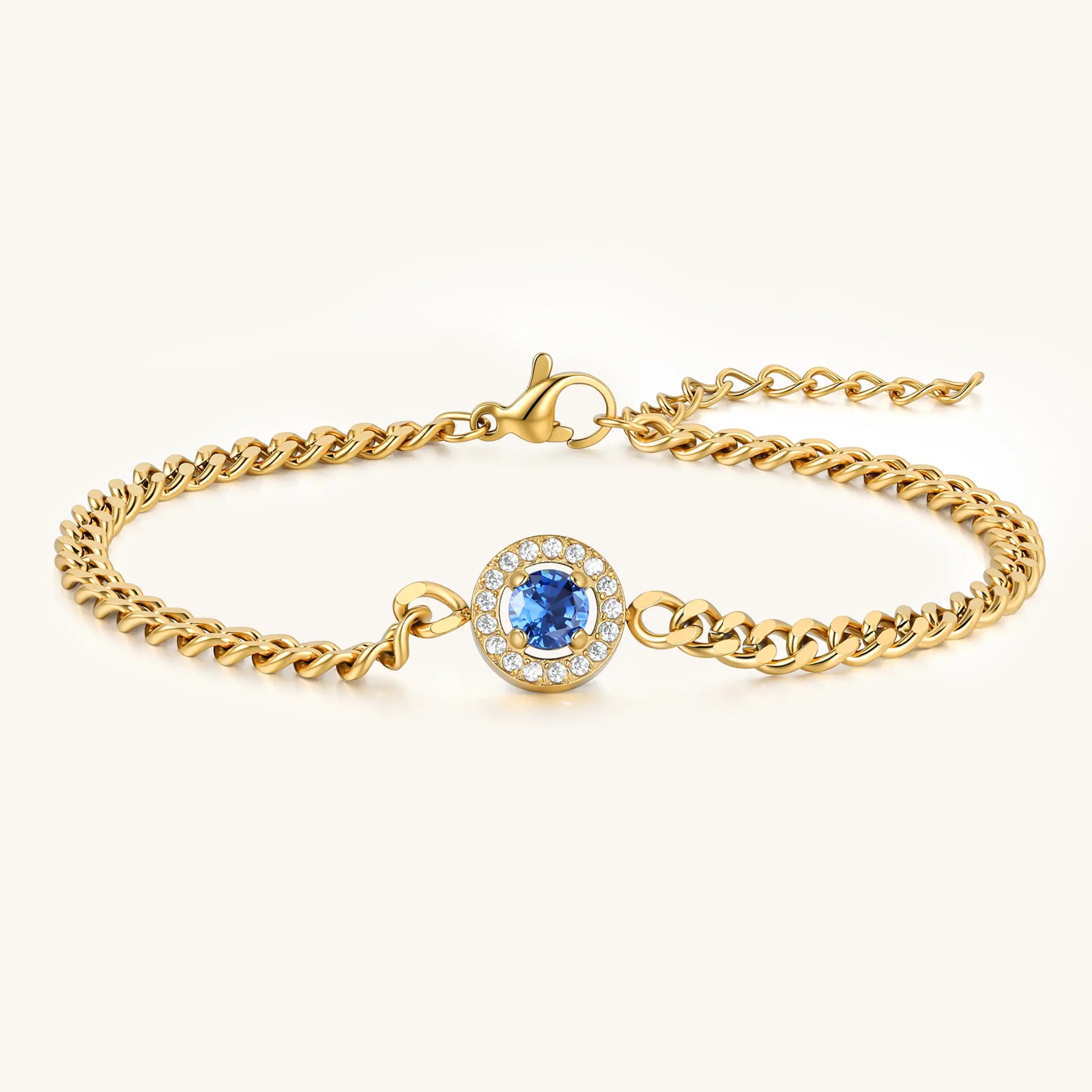 Vilrian gold plated stainless steel curb chain bracelet with round sapphire blue halo zirconia